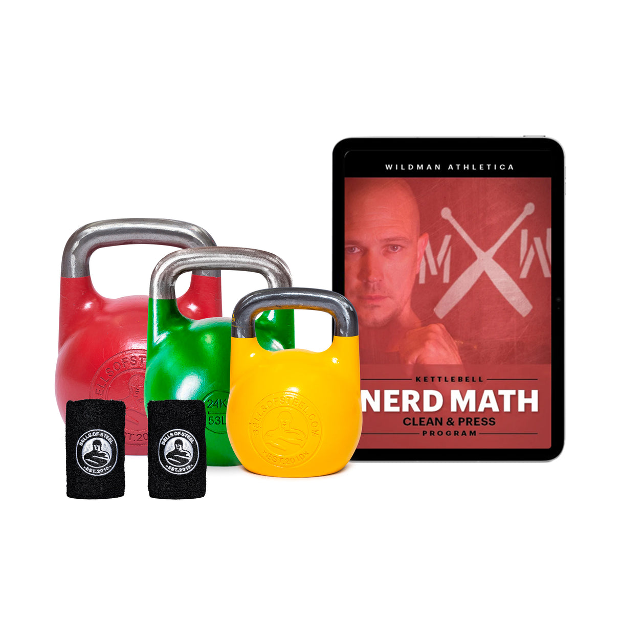 Three vibrant kettlebells in red, green, and yellow are next to two black wristbands and a tablet. Displayed is the "Wildman Clean & Press Kettlebell Bundle" by Bells of Steel, designed for total-body strength and shoulder stability, featuring colorful kettlebells and an athlete on the cover.