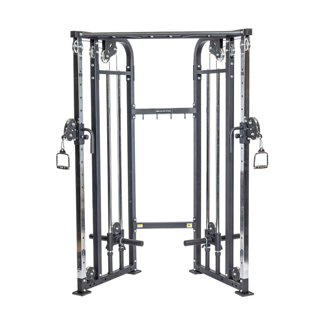 The Bells of Steel Functional Trainer is a freestanding cable crossover machine with adjustable handles, weight stacks, and a metal frame. It includes a central pull-up bar and multiple attachment points, ideal for various exercises in a comprehensive strength training routine.