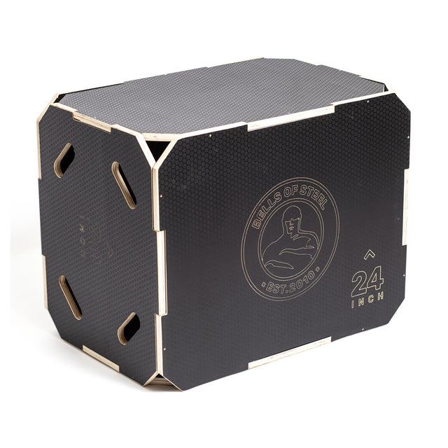 A black 24-inch "Bells of Steel" 3-in-1 Anti-Slip Wood Plyo Box, complete with cut-out handles, features the brand's logo and measurements, providing three different heights for versatile home gym workouts.