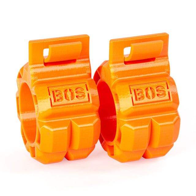 The Barbell Zip Clips by Bells of Steel are two bright orange plastic clips with "BOS" embossed on them, designed to securely hold weights on a barbell. They feature a rugged, ergonomic design similar to a pressure-cuff and an easy clip mechanism for quick attachment and removal.