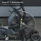 Close-up of the Bells of Steel Blitz Max Air Bike, a premium fitness machine with a 25-inch, 7-blade steel fan and adjustable air damper. The black bike with yellow accents is placed on a gray floor against a gray wall.