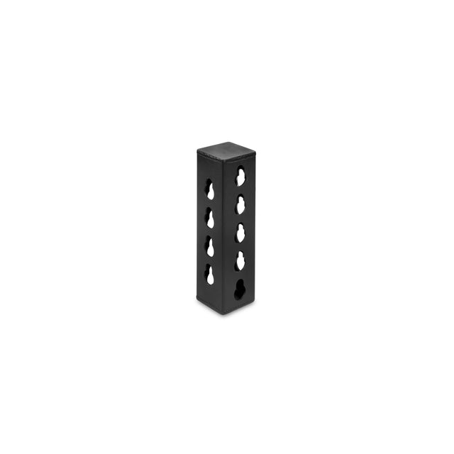 The Bells of Steel Rack Junctions - 3" x 3" is a black rectangular metal block with six evenly spaced holes on each visible side, perfect for customizable rack setups, shown standing upright against a white background.