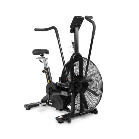 The Bells of Steel Blitz Air Bike is a commercial-grade cardio machine with a large front fan, upright handlebars, adjustable seat, and digital display—ideal for intense indoor workouts.