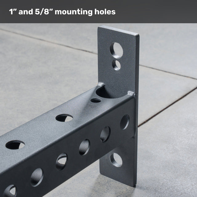 Close-up of the Bells of Steel Crossmember For Converter Bench - 43", a black metal bracket with multiple round mounting holes at right angles—perfect for rack setups or reinforcing crossmembers—with "1” and 5/8” mounting holes" text on top.