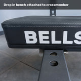 Close-up of the Bells of Steel Crossmember For Converter Bench - 43" attached to a bench with adjustment holes. Caption reads, "Drop in bench attached to crossmember." An ideal addition for your rack setup.