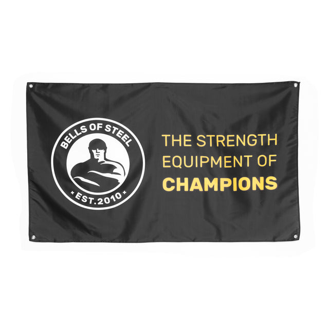 A black flag featuring the "Bells of Steel" logo, highlighting a muscular figure alongside "EST. 2010" on the left side. Ideal for gym decor, its right side prominently presents "THE STRENGTH EQUIPMENT OF CHAMPIONS" in striking yellow and white. It's a perfect addition to any fitness space or home gym flag collection.