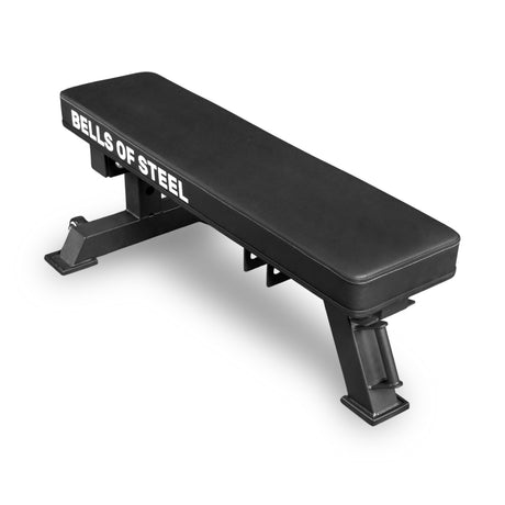 The Bells of Steel Converter Bench - Flat Bench is a black flat weight bench with “BELLS OF STEEL” in white on the side, designed for gym strength training and built to IPF competition height for an authentic experience.