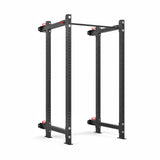 The Bells of Steel Roc Foldable 4 Post Cage Builder features a black metal design with four vertical posts and a horizontal pull-up bar. It supports up to 1,000 pounds, offers multiple height adjustments with ⅝" holes, and includes red safety spotter arms suitable for weightlifting and strength training.