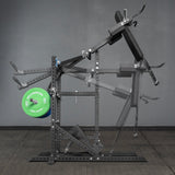 The Bells of Steel Pandemonium Squat – 3-in-1 Pendulum Squat / Calf Press / Viking Press Machine is pictured in a home gym with a weight plate, showing its range of motion using adjustable pads and handles.