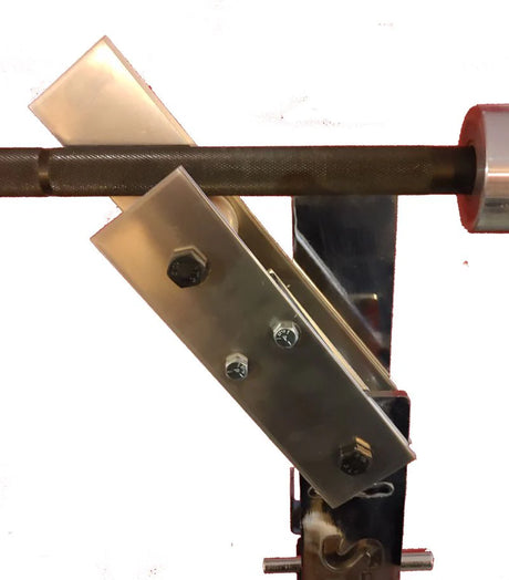 A close-up of the metal bar on the Bells of Steel StrongArm Combo Rack – Squat Stand & Bench Press, featuring angled steel brackets with bolts and a wheel-like part on the right, shown against a white background.
