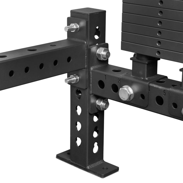 Close-up of Bells of Steel Rack Junctions - 3" x 3" in black metal, featuring adjustable holes, sturdy bolts, pins, and a weight stack—perfect for building a customizable home gym rack with secure connections.