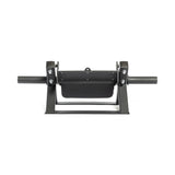 The Bells of Steel Tibialis Trainer Machine features a black metal holder with two cylindrical handles designed to secure a rectangular black plate. This unit includes bolts and a frame, ensuring stability on any surface, making it perfect for strength training routines.