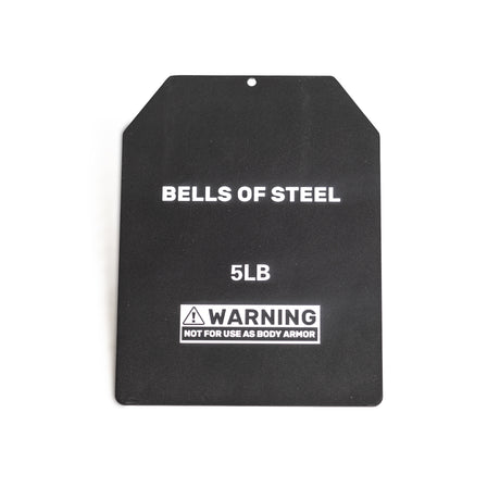 A rectangular black 5lb weight plate from Bells of Steel Canada, designed as a ruck plate for training, features angled top corners and text "BELLS OF STEEL 5LB." A triangle symbol warns "NOT FOR USE AS BODY ARMOR." Ideal for integrating with weighted vests.